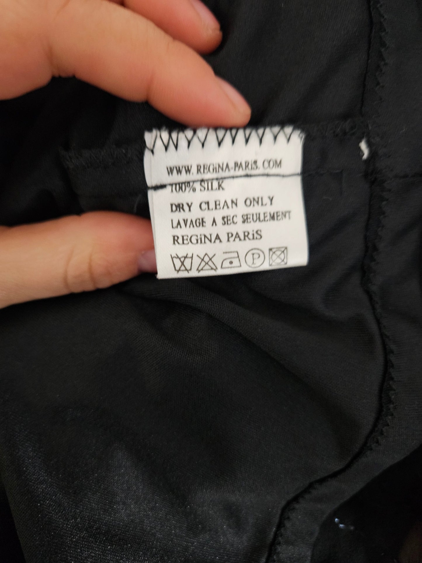 Black outfit embroidered with red roses