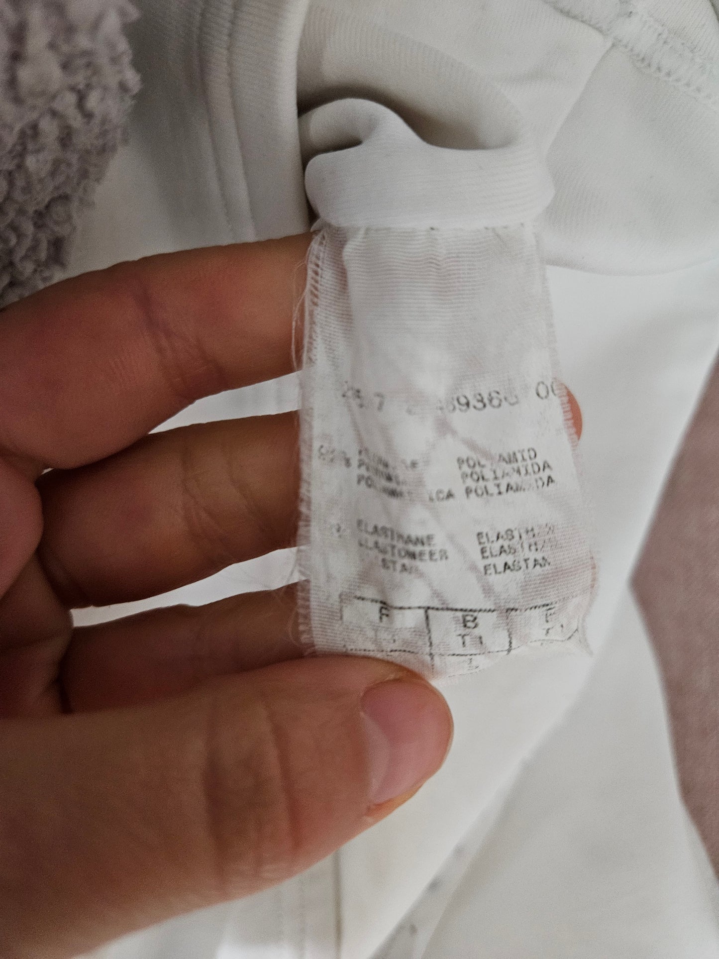 White fitted top with a small V-neck