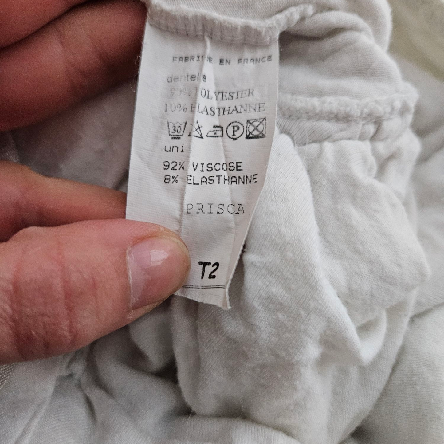 Débardeur asymétrique en dentelle blanche