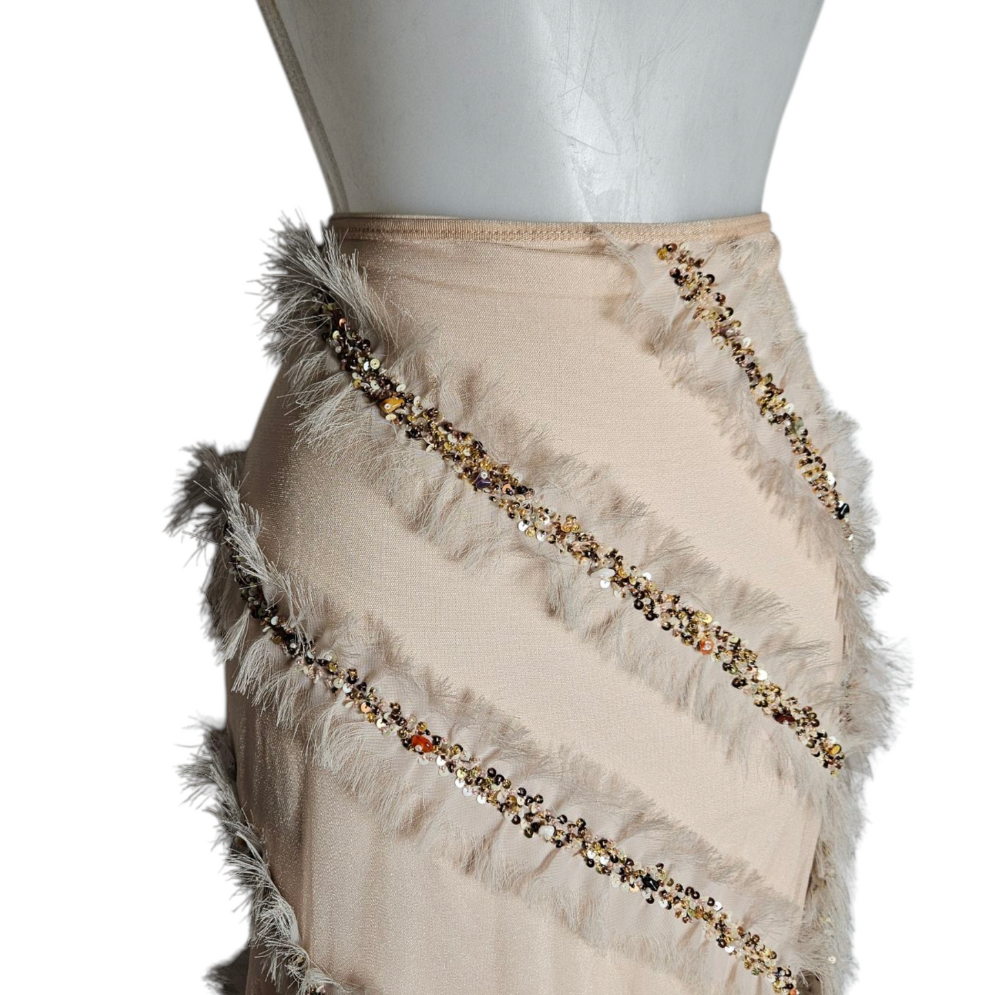 Asymmetrical skirt with feather and pearl details