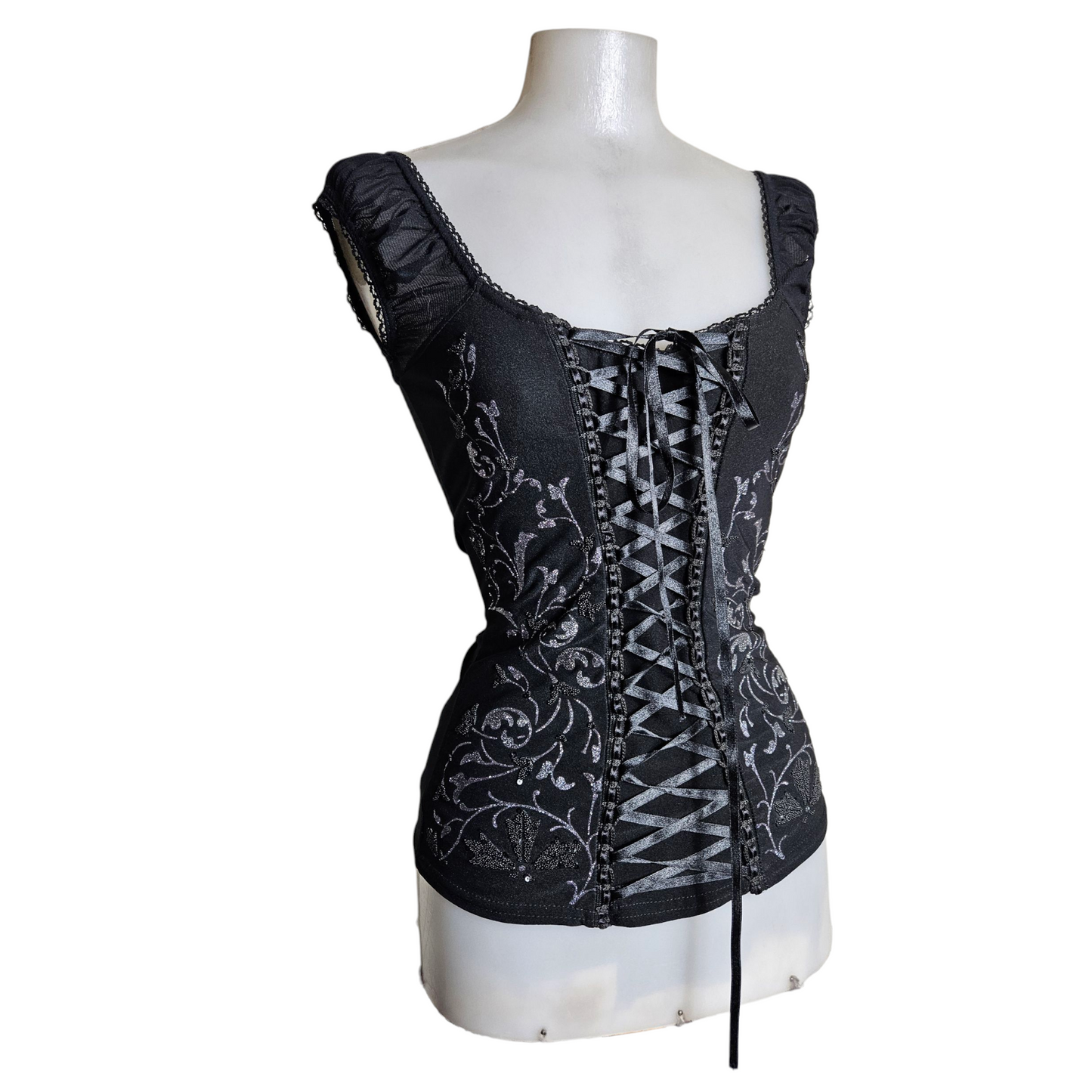 Lace-up top decorated with silver arabesques