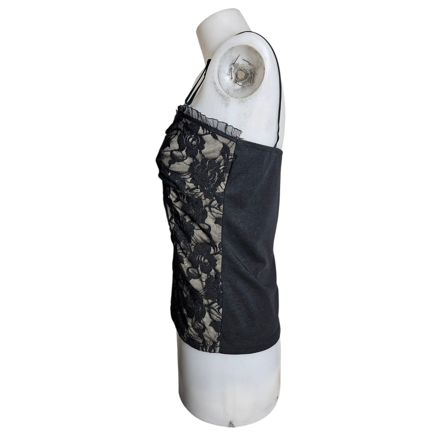 Black lace corset top on a beige background