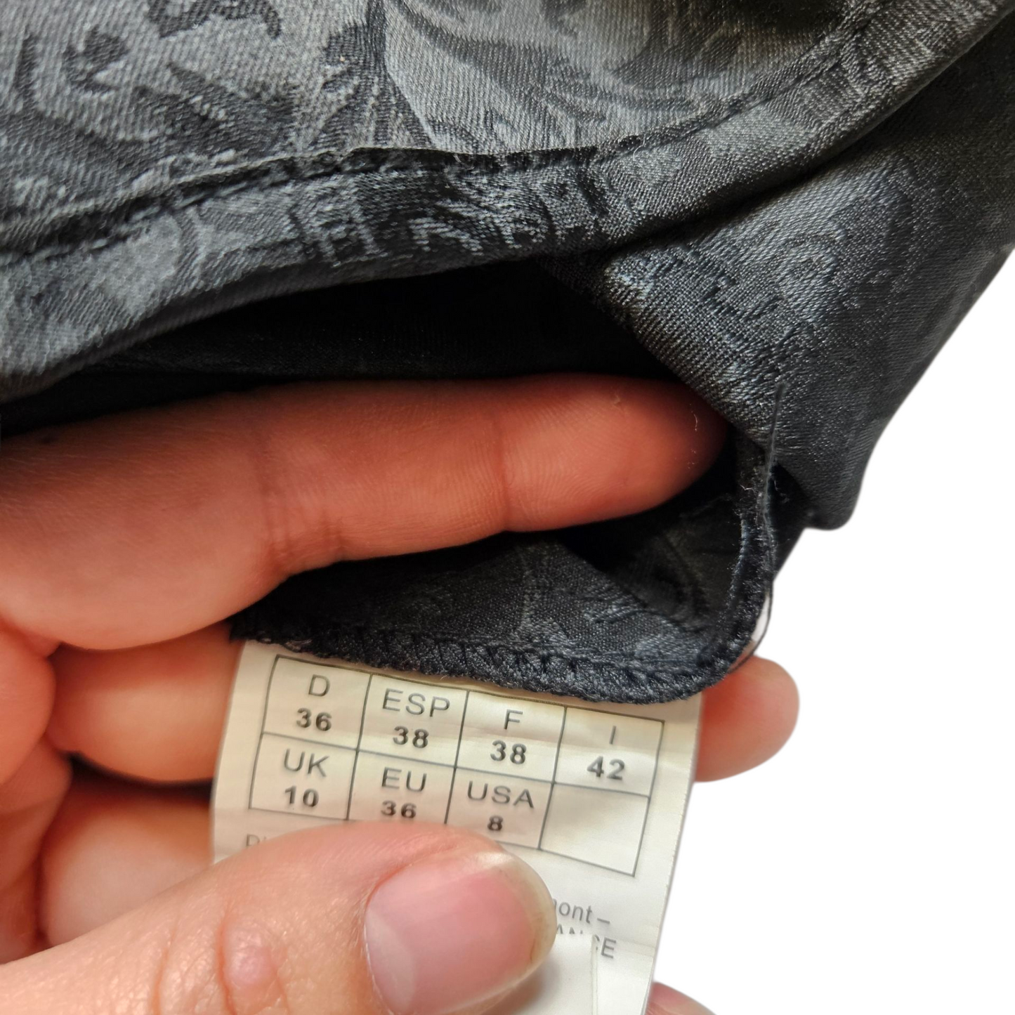 Black top with arabesque pattern