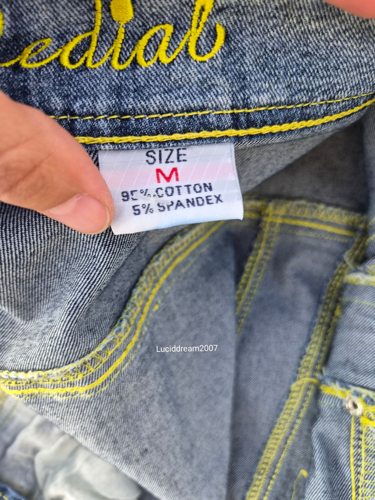 Denim jacket with zip and strap details