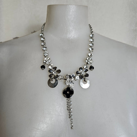Metal necklace with flowers and charms