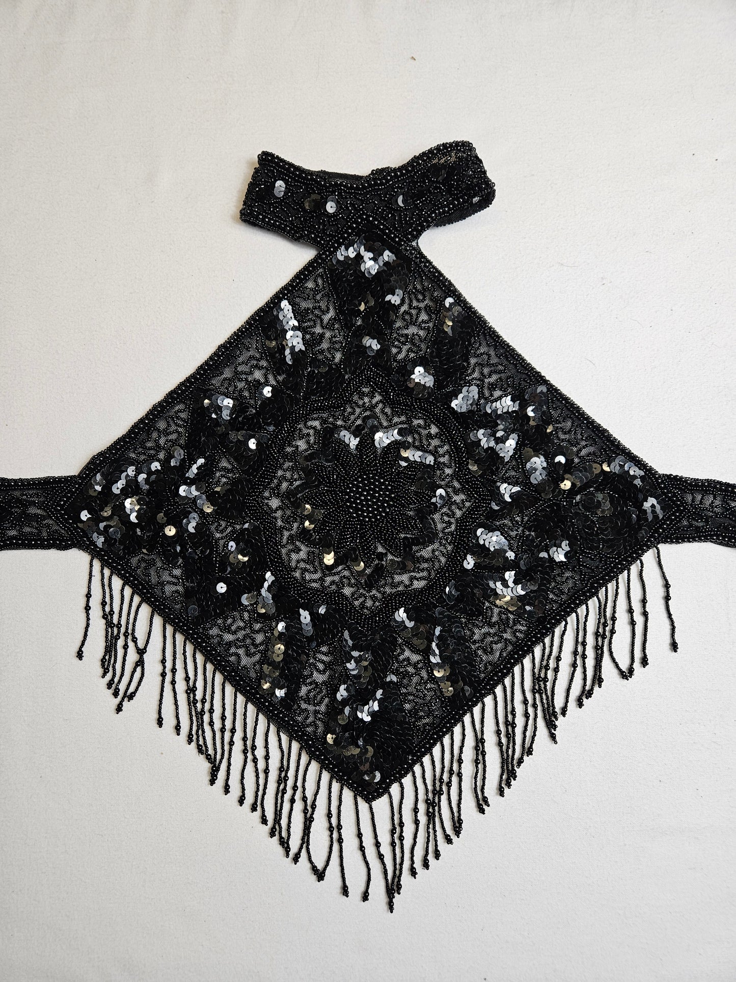 Black open back embroidered with sequins