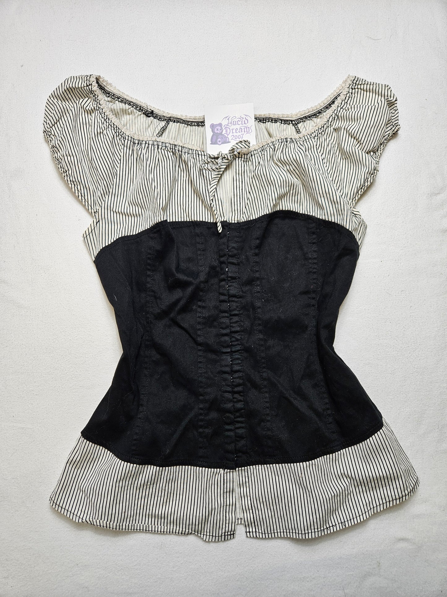 Haut effet superposition fermeture agrafes