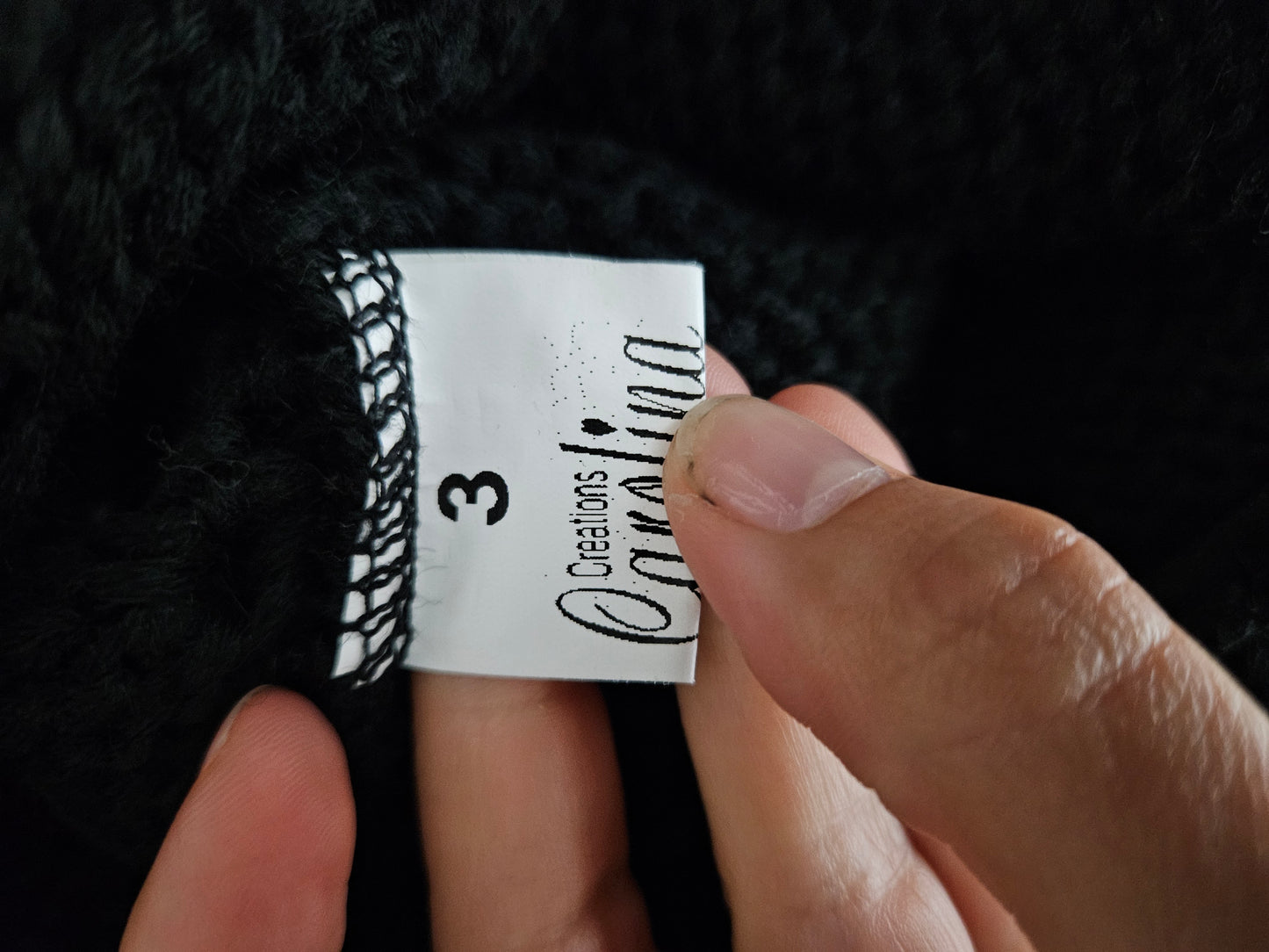 Pull asymétrique détails satinés