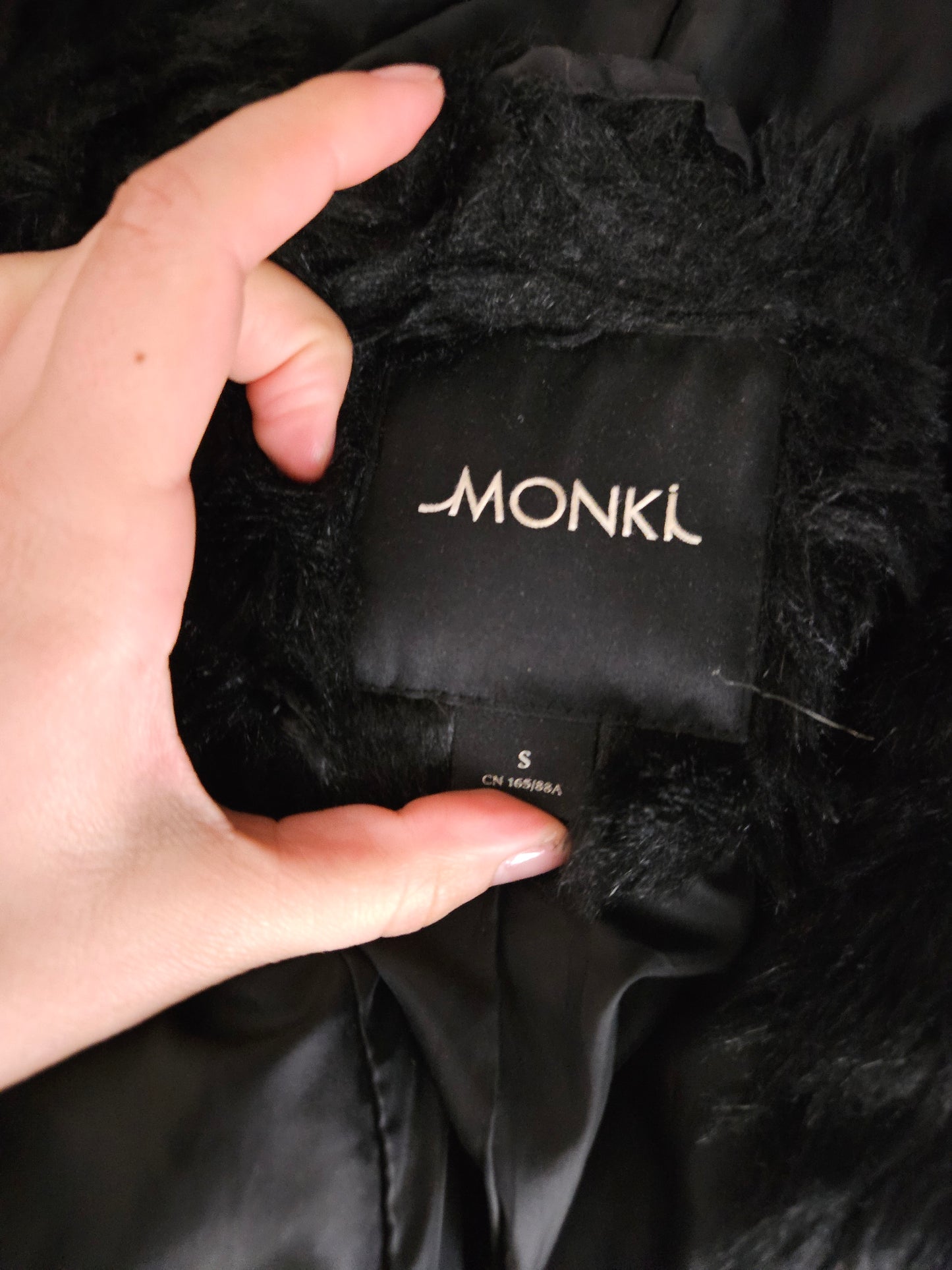 Manteau fausse fourrure à capuche