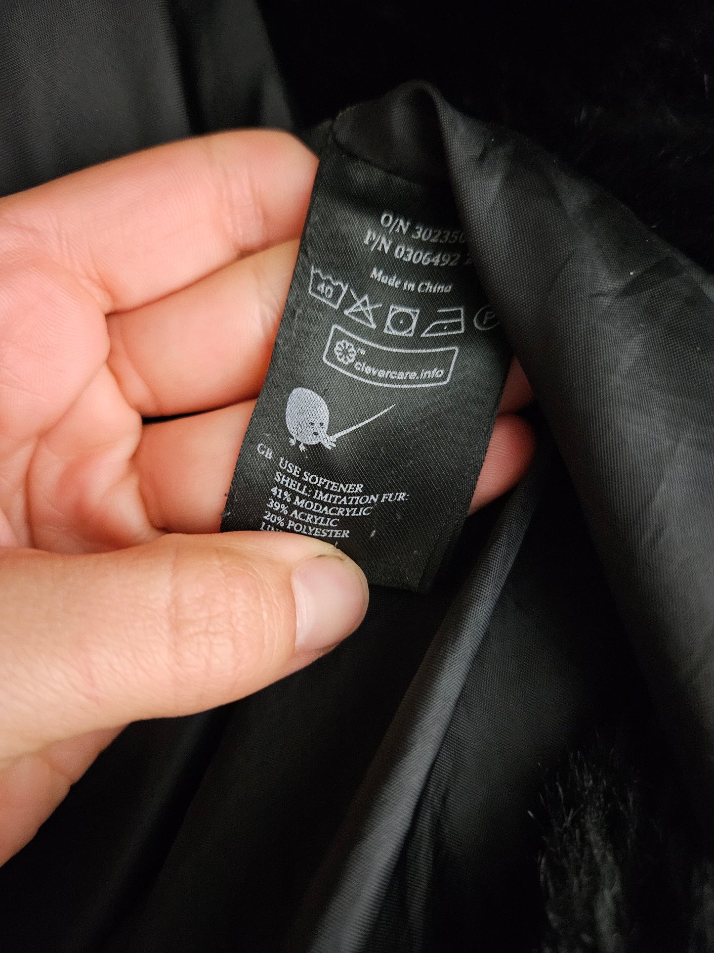 Manteau fausse fourrure à capuche