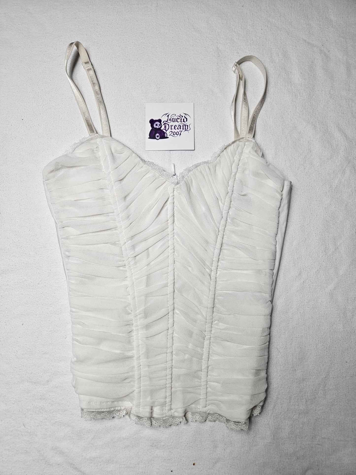 Haut à baleines en voile plissé