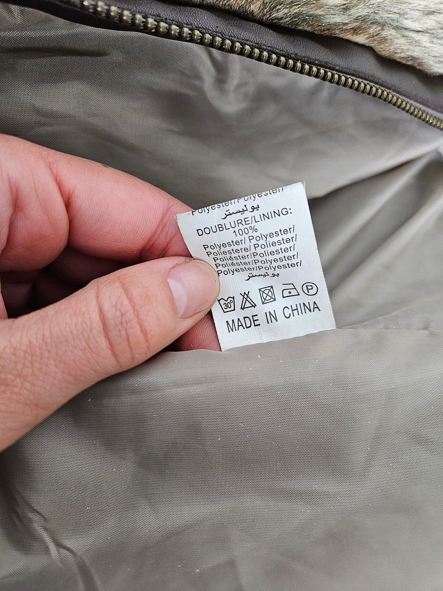 Manteau court fausse fourrure