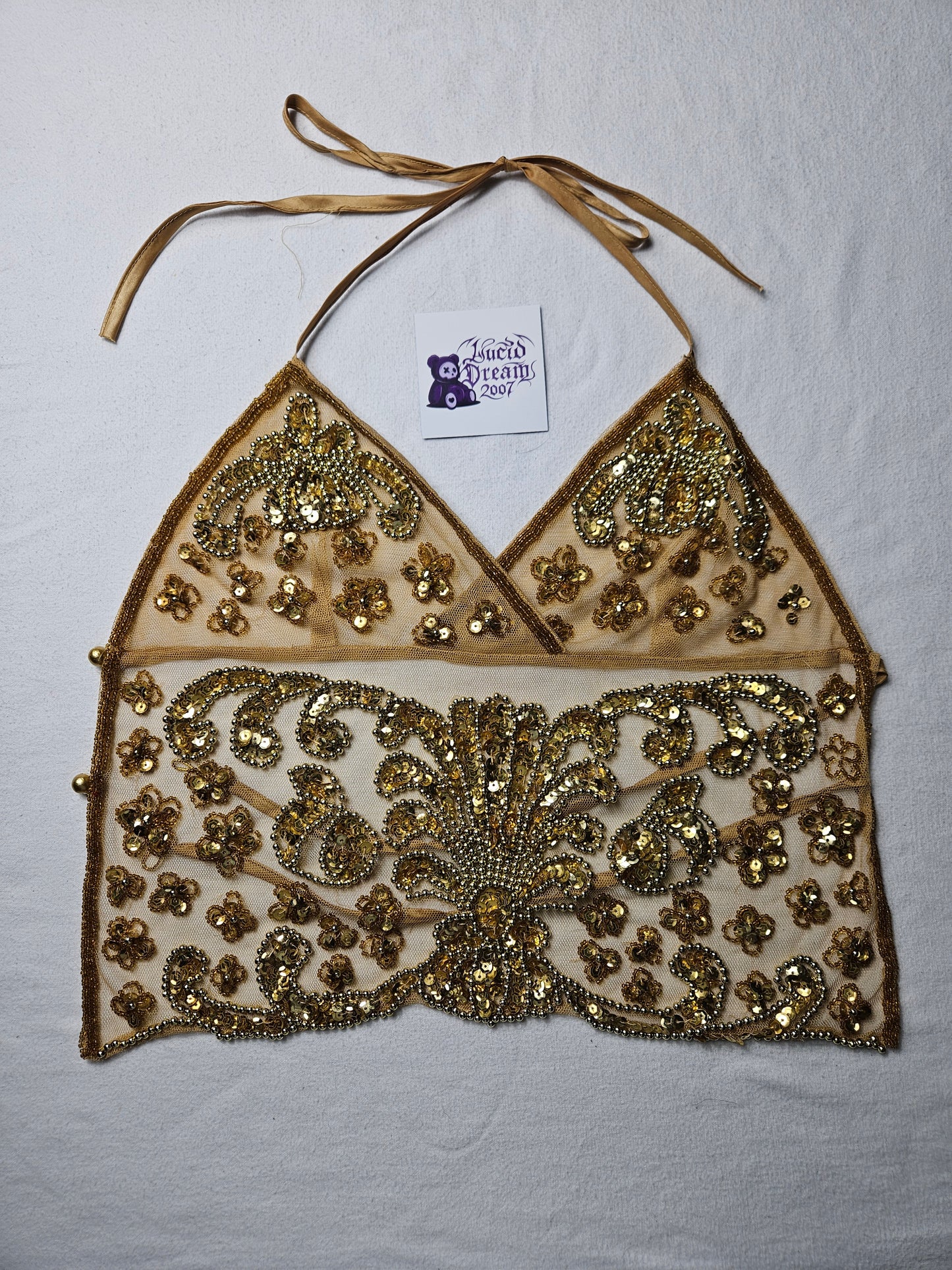 Open back in gold embroidered voile