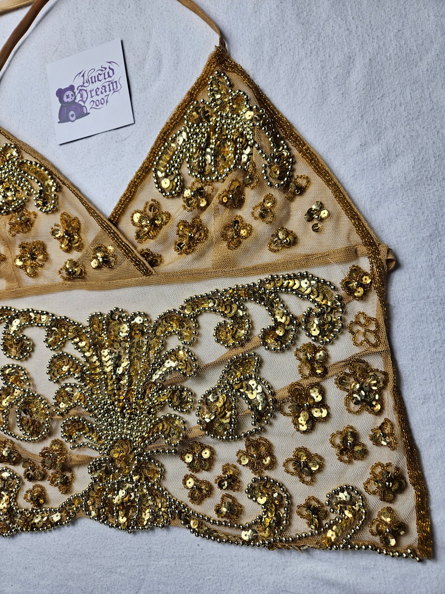 Open back in gold embroidered voile