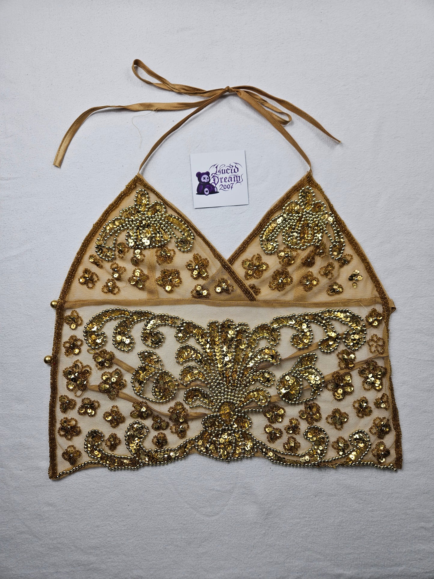 Open back in gold embroidered voile