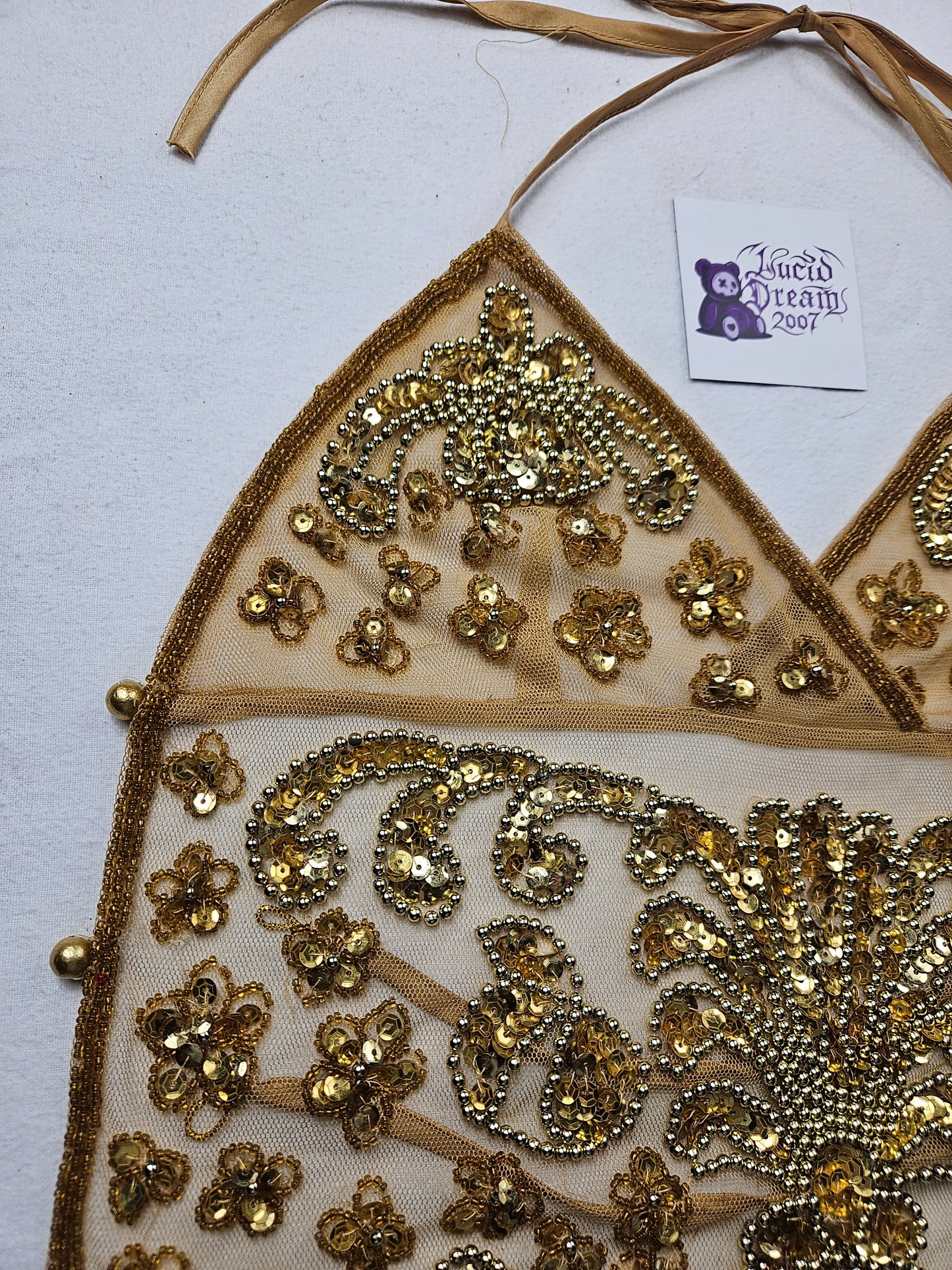 Open back in gold embroidered voile