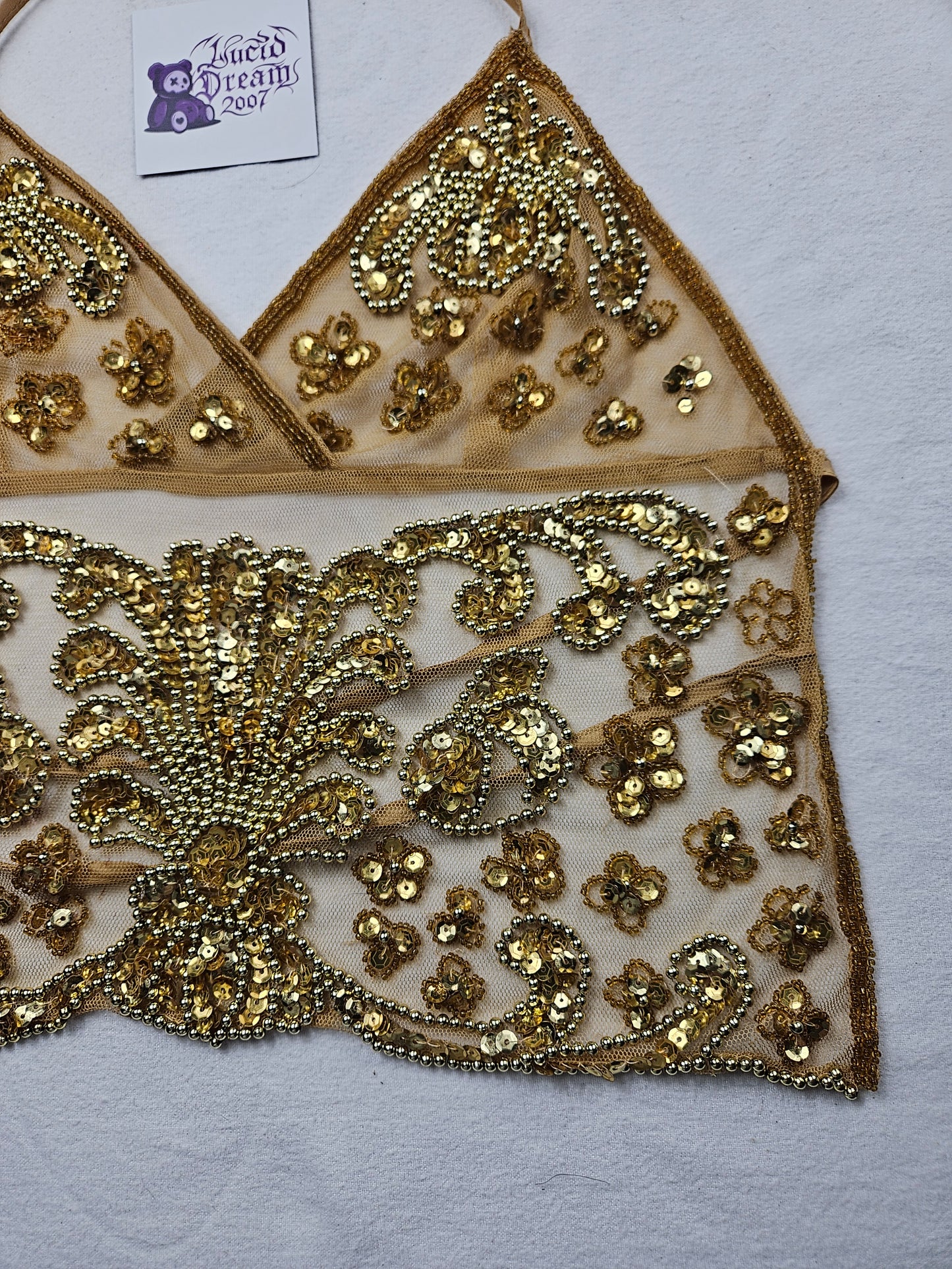 Open back in gold embroidered voile