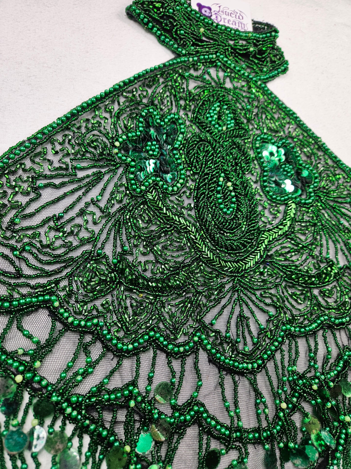 Dos nu brodé de sequins vert et noir
