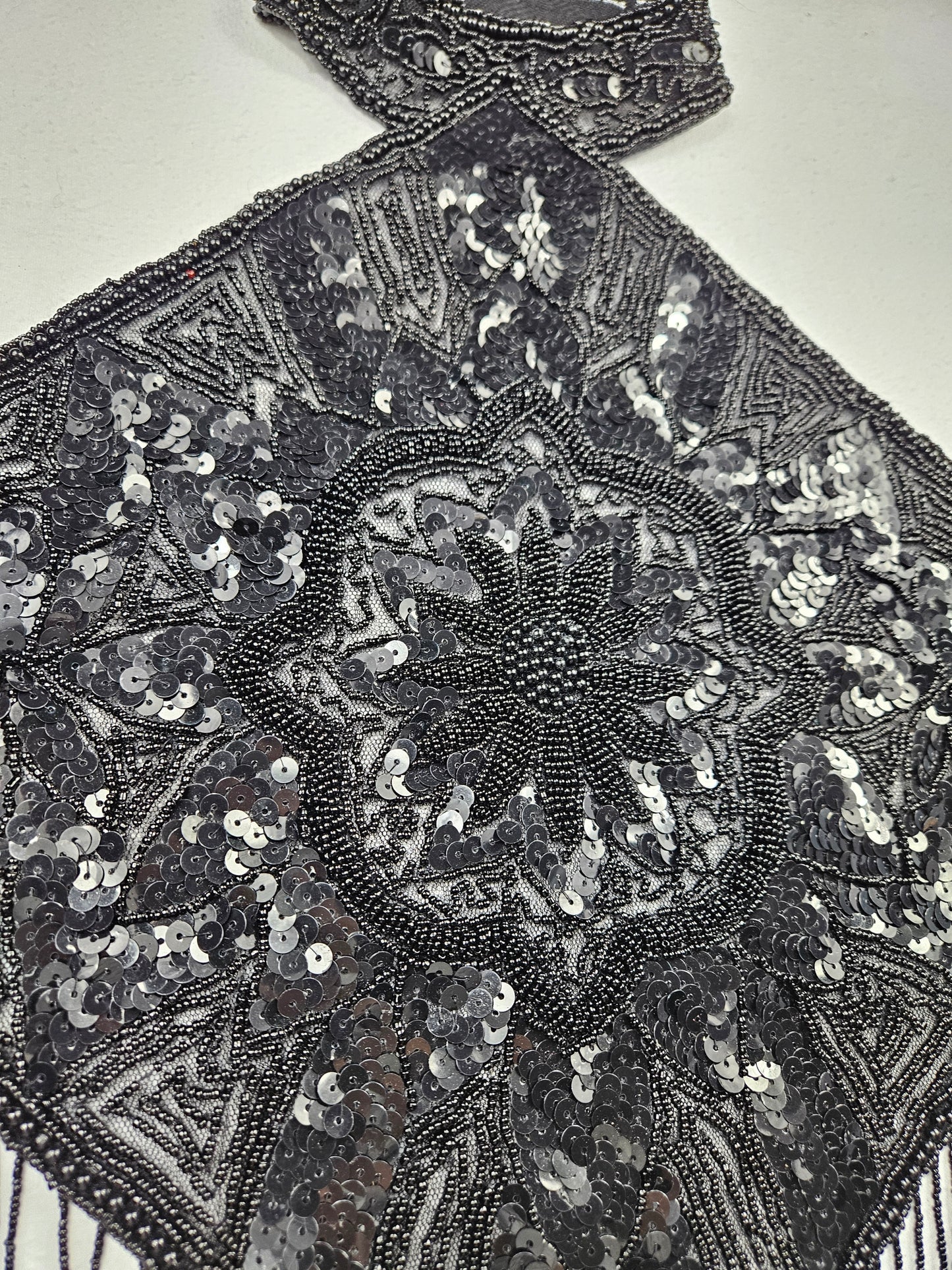 Black open back embroidered with sequins