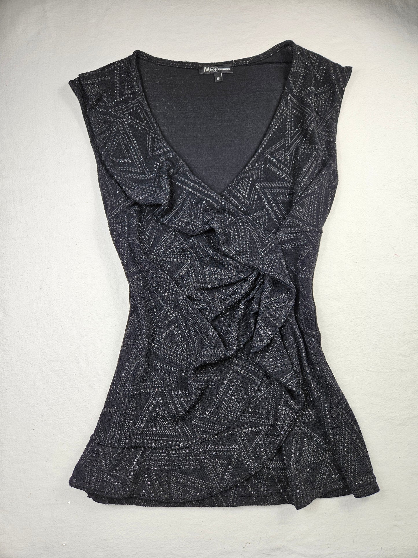 Top with ruffles and rhinestones