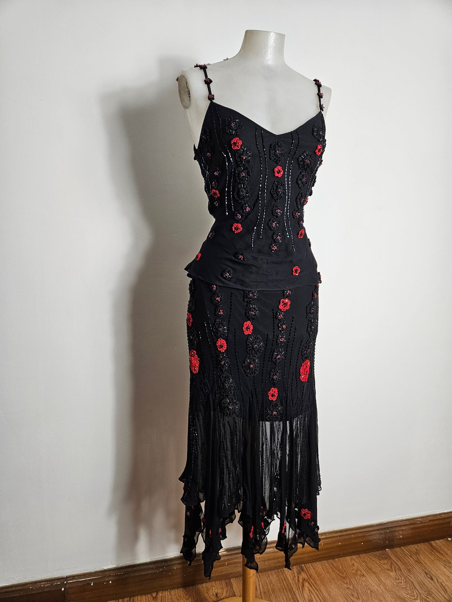 Black outfit embroidered with red roses