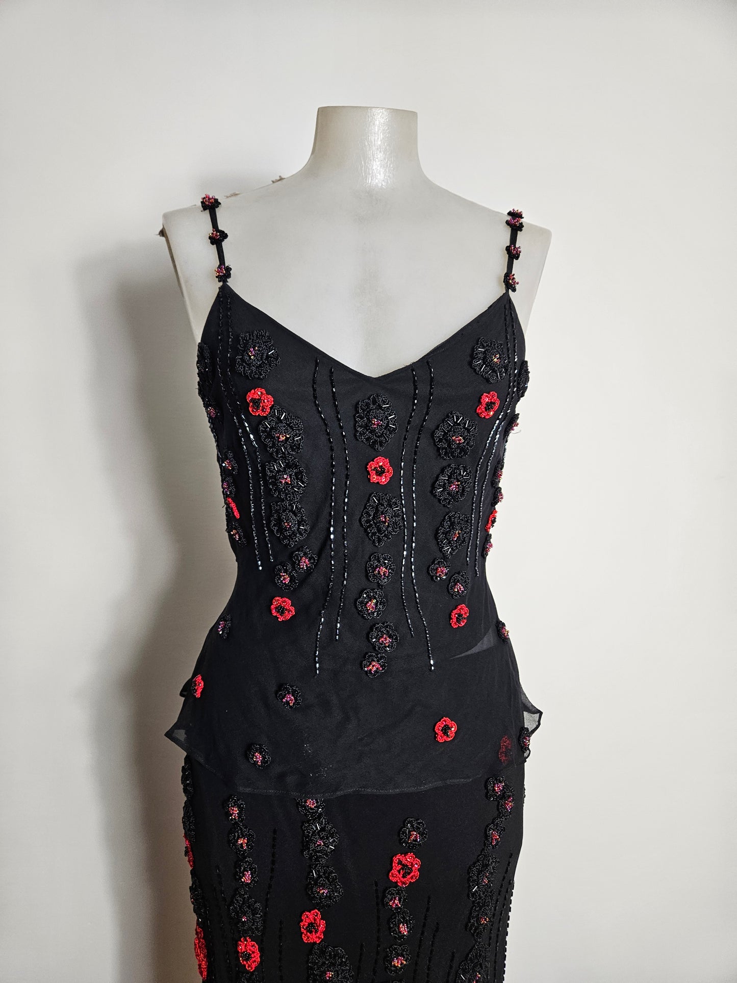 Black outfit embroidered with red roses