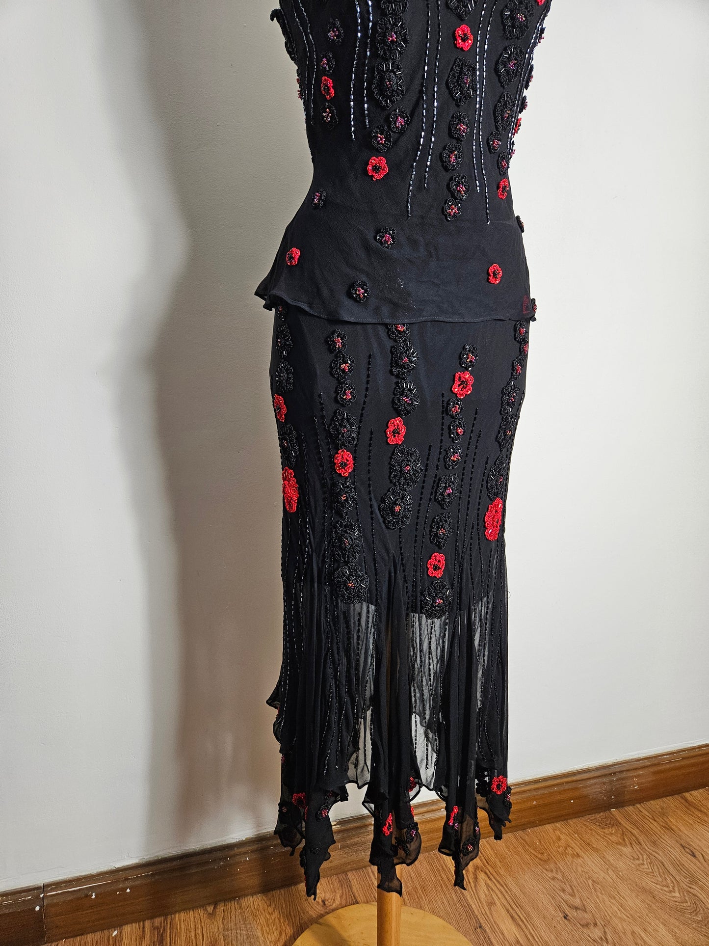 Black outfit embroidered with red roses