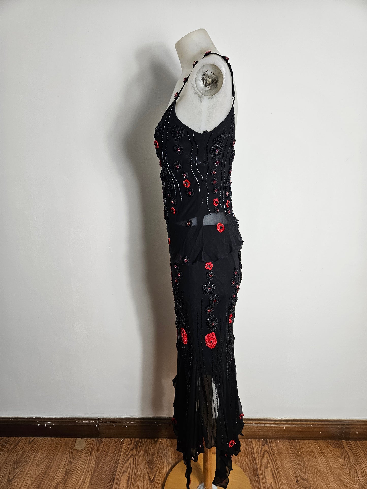 Black outfit embroidered with red roses