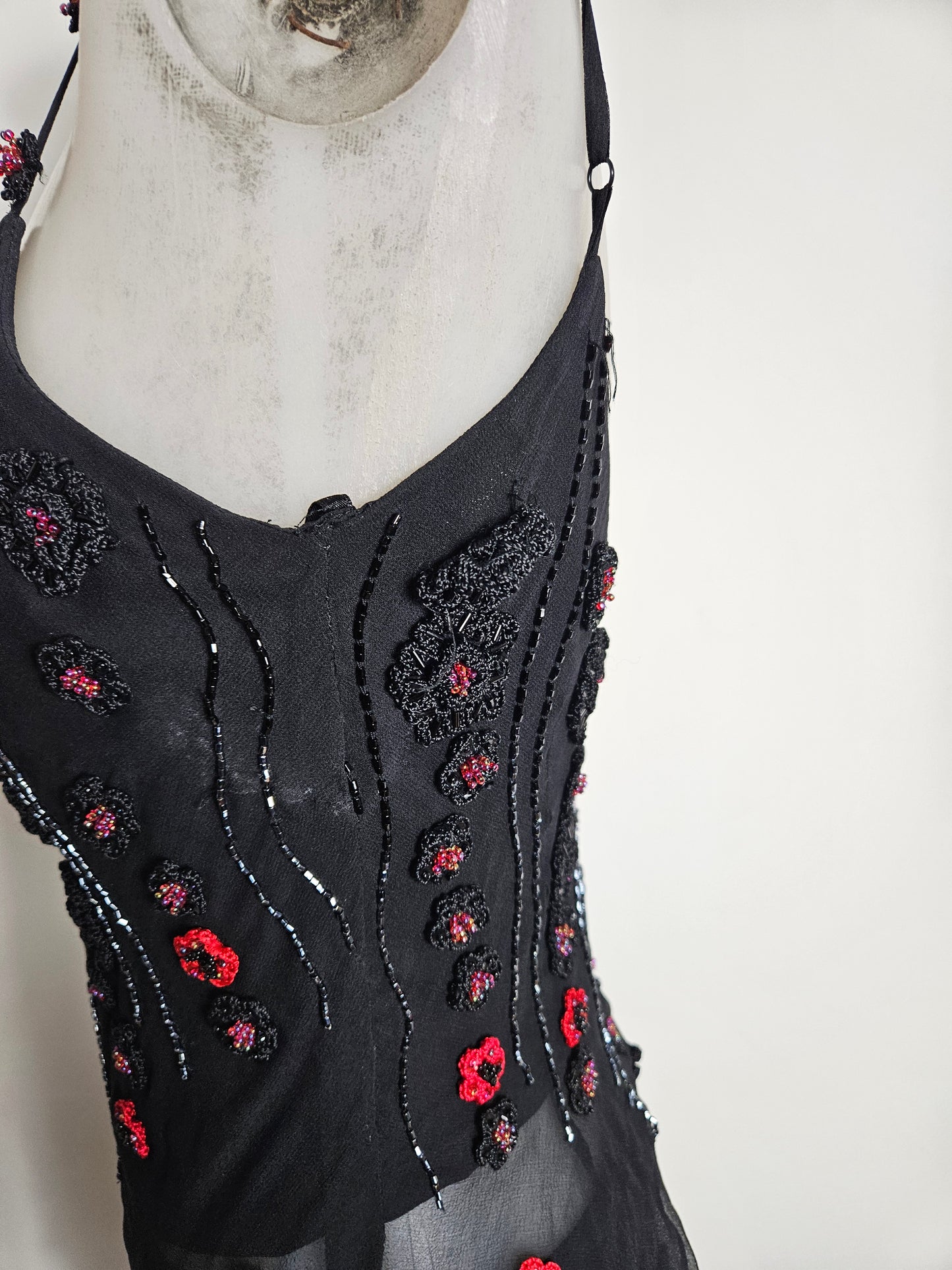 Black outfit embroidered with red roses