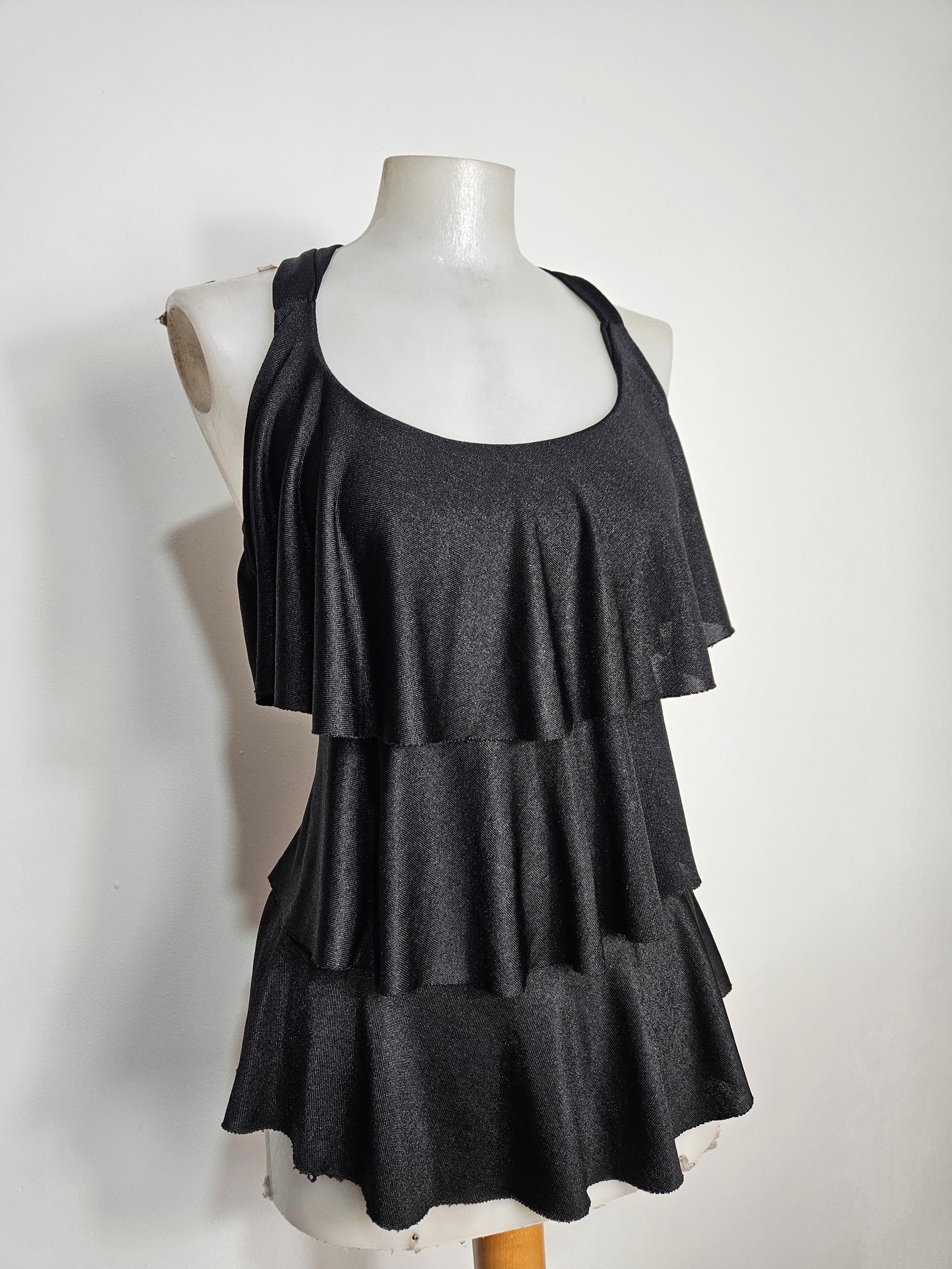 High-backed, ruffled top