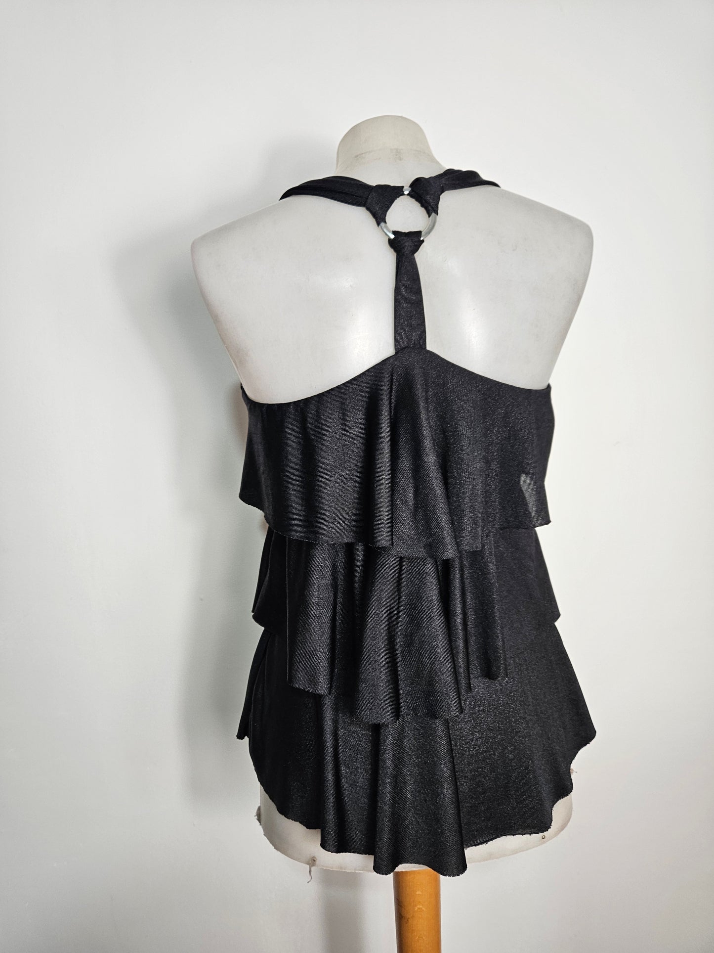 High-backed, ruffled top