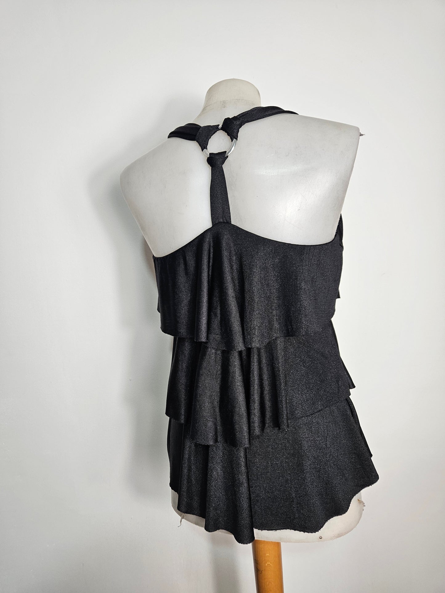 High-backed, ruffled top