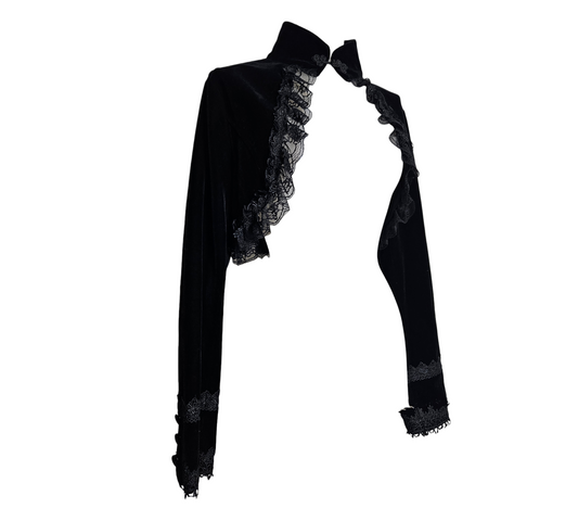 A luxurious whimsigoth black velvet bolero featuring a high mandarin collar and dramatic ruffled lace trim. This enchanting fairycore layering piece includes tiered lace details on the cuffs for a dark romantic reverie.