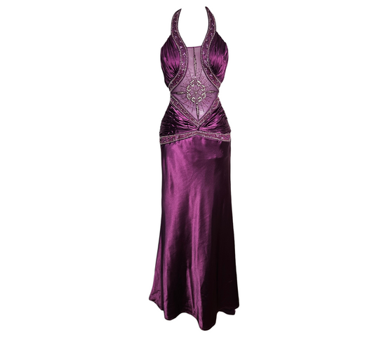 A mesmerizing Y2K prom-style satin gown in deep plum purple. Features a sheer mesh bodice with intricate rhinestone starburst patterns, beaded waist details, and a graceful mermaid tail for a pure reverie aesthetic.