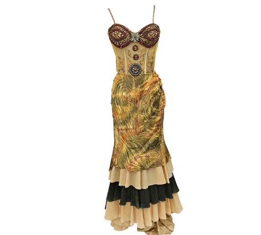 Two-piece embellished corset and maxi skirt set in gold and olive tones, rhinestone details and layered ruffle hem, dreamy Y2K goddess fairycore vibe.