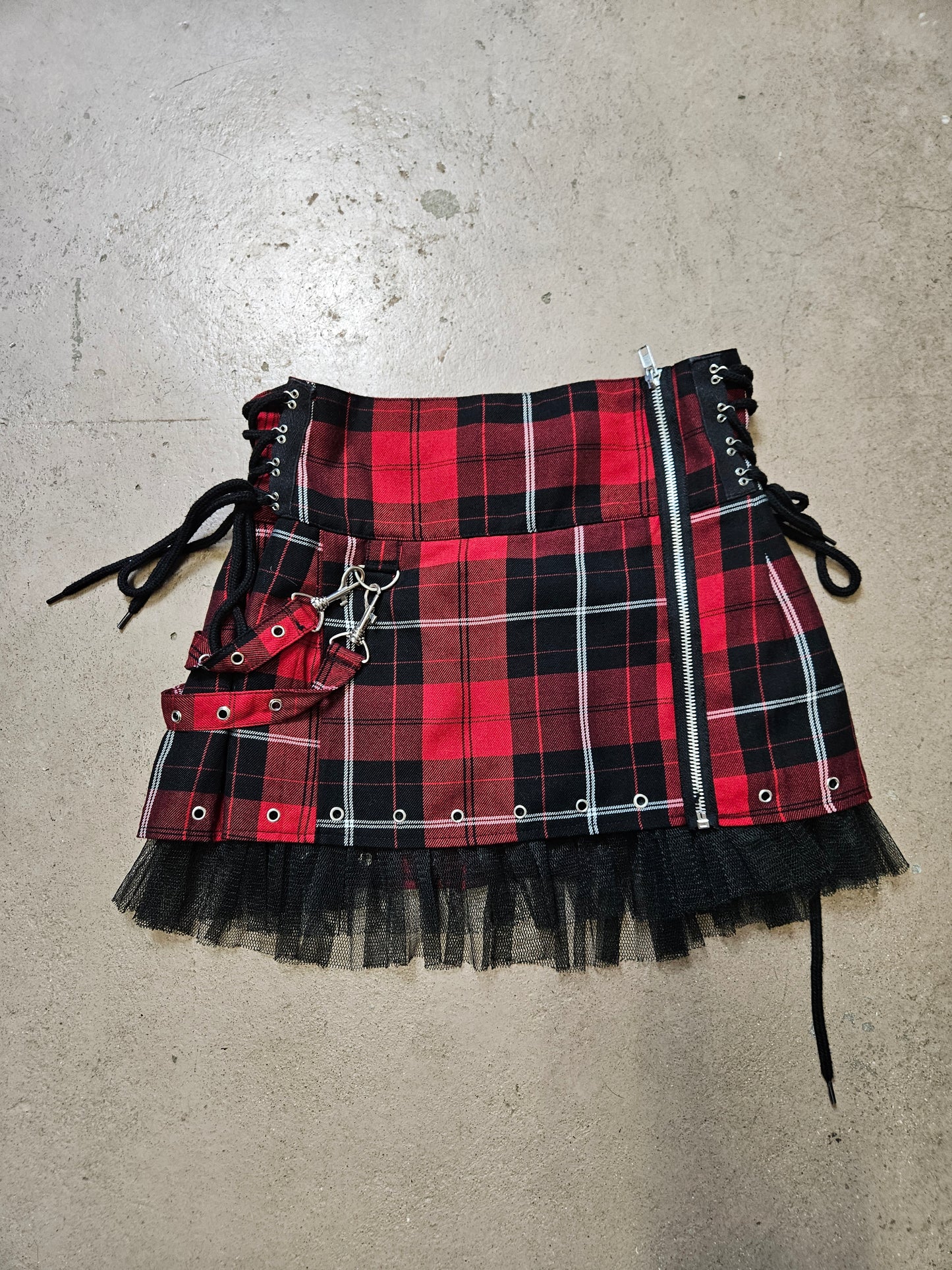 Mini jupe tartan à sangles