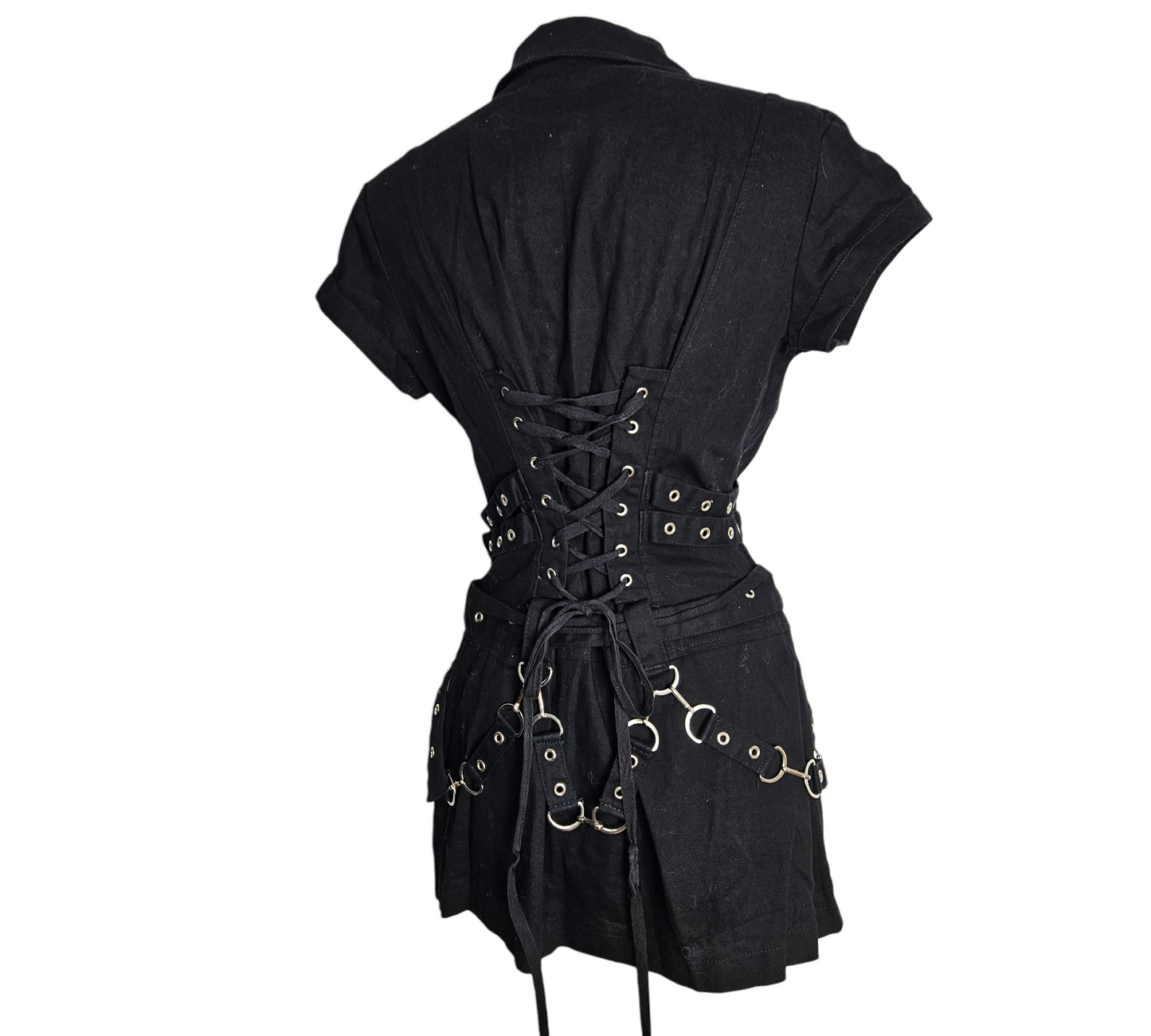 Black zip-up mini dress with corset back, metal rings and belt details, edgy Y2K goth vibes, dark fairycore aesthetic, unique statement piece.