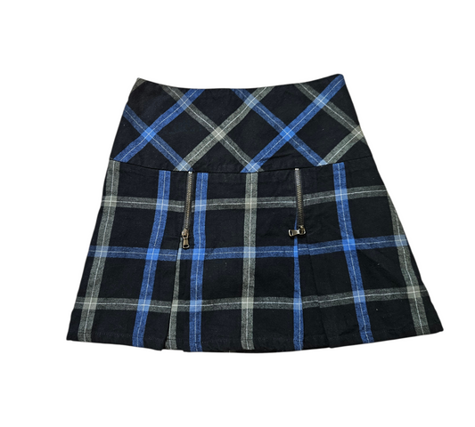 A Y2K style mini skirt with a blue and black plaid pattern, featuring decorative silver zippers and a pleated hem for a grunge-inspired aesthetic.