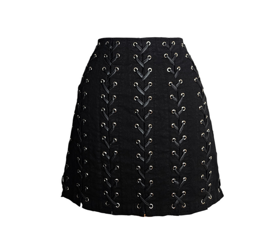 Black vintage Tripp NYC lace-up mini skirt with metal eyelets, gothic punk Y2K style, rare alternative fashion piece