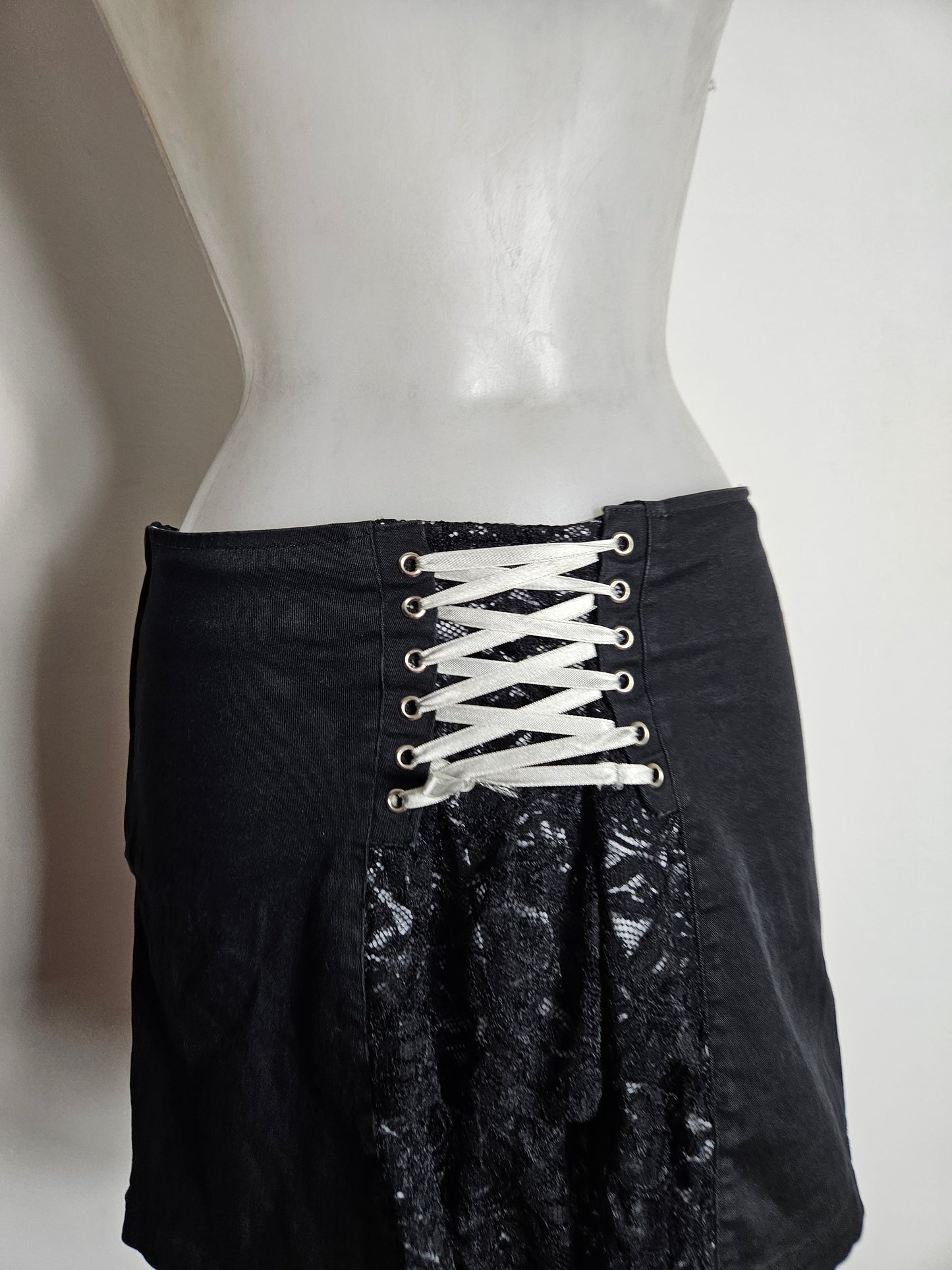 Mini skirt with lace and lacing