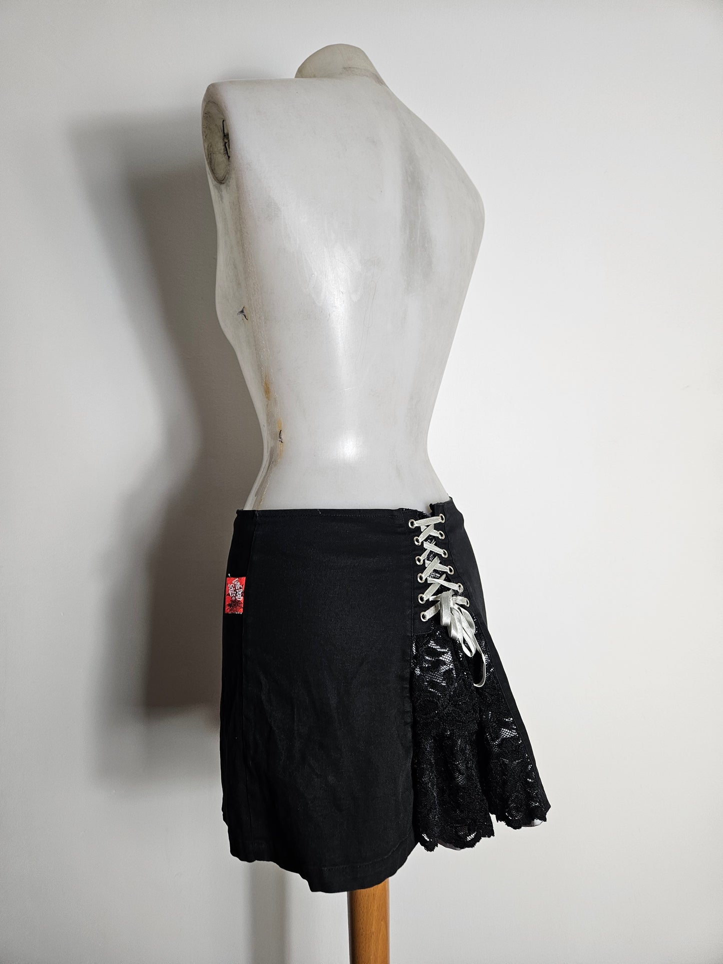 Mini skirt with lace and lacing