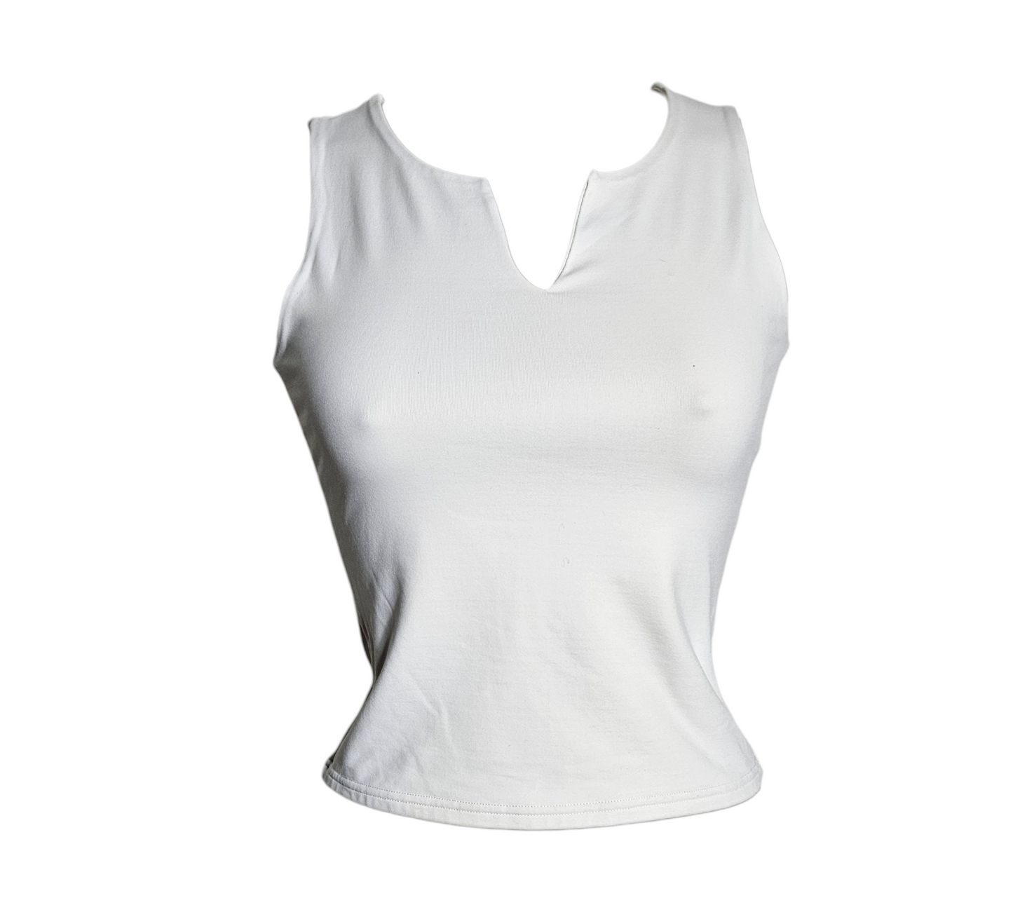 Vintage white sleeveless fitted top with a round neckline and small V-slit detail at the front, minimalist Y2K basic, by Lucid Dream 2007.