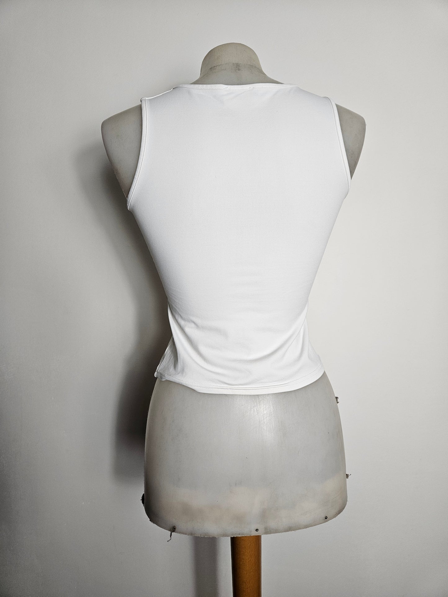White fitted top with a small V-neck