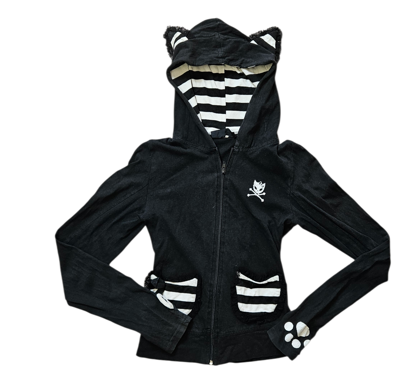 A striking Y2K goth-loli black hoodie featuring a cat-skull logo, striped ruffle pockets with ribbons, and a bold corset-style lace-up back for a perfect dark reverie aesthetic.