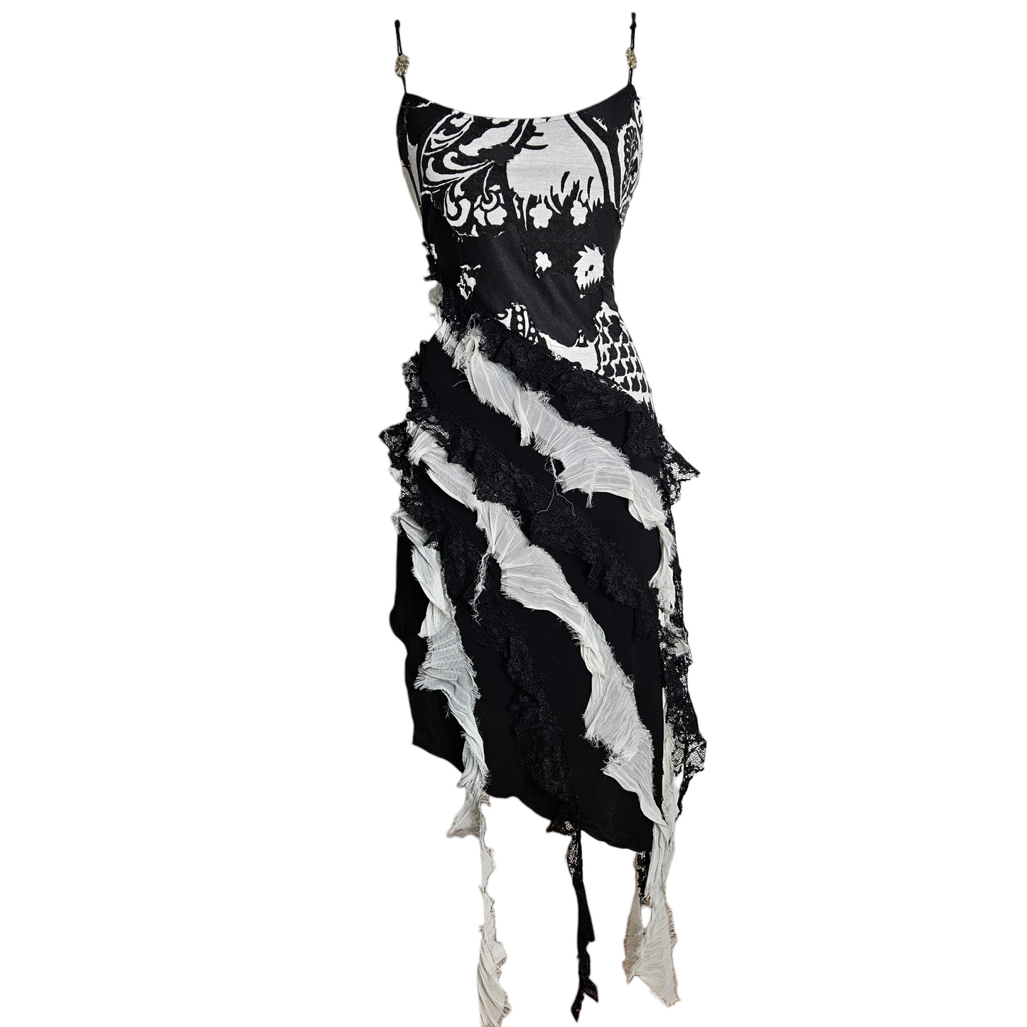 Black and white layered dress with lace ruffles and distressed finishes, fairycore whimsigoth aesthetic, dramatic texture and early 2000s gothic vibe.
