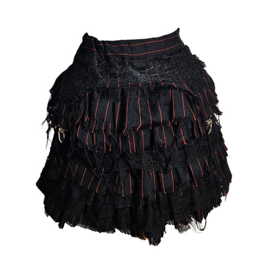 Black ruffled mini skirt with red pinstripes, layered lace and raw edges, dark fairycore and whimsigoth vibe, dramatic Y2K gothic aesthetic.