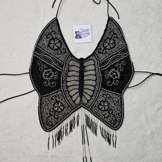 Dos nu papillon brodé de perles et sequins