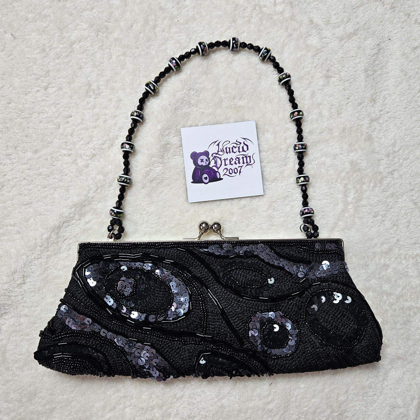Bandolera negra con perlas y lentejuelas