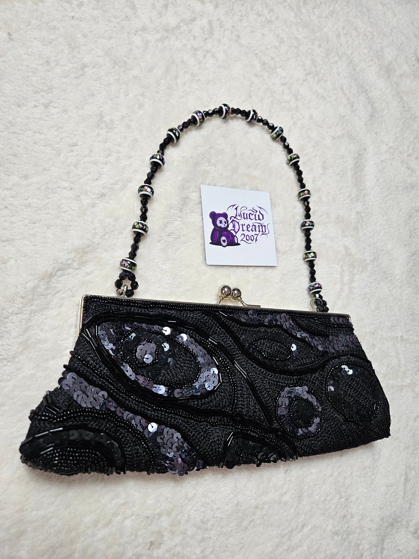 Bandolera negra con perlas y lentejuelas