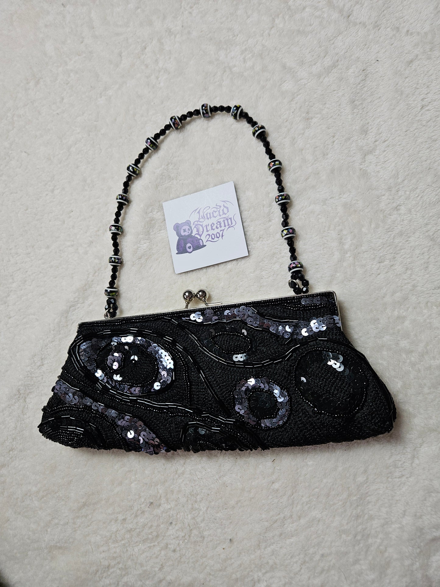 Bandolera negra con perlas y lentejuelas